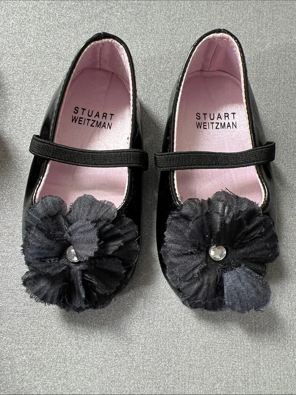 Stuart Weitzman Black Patent Mary Jane Shoes with Flower Accent